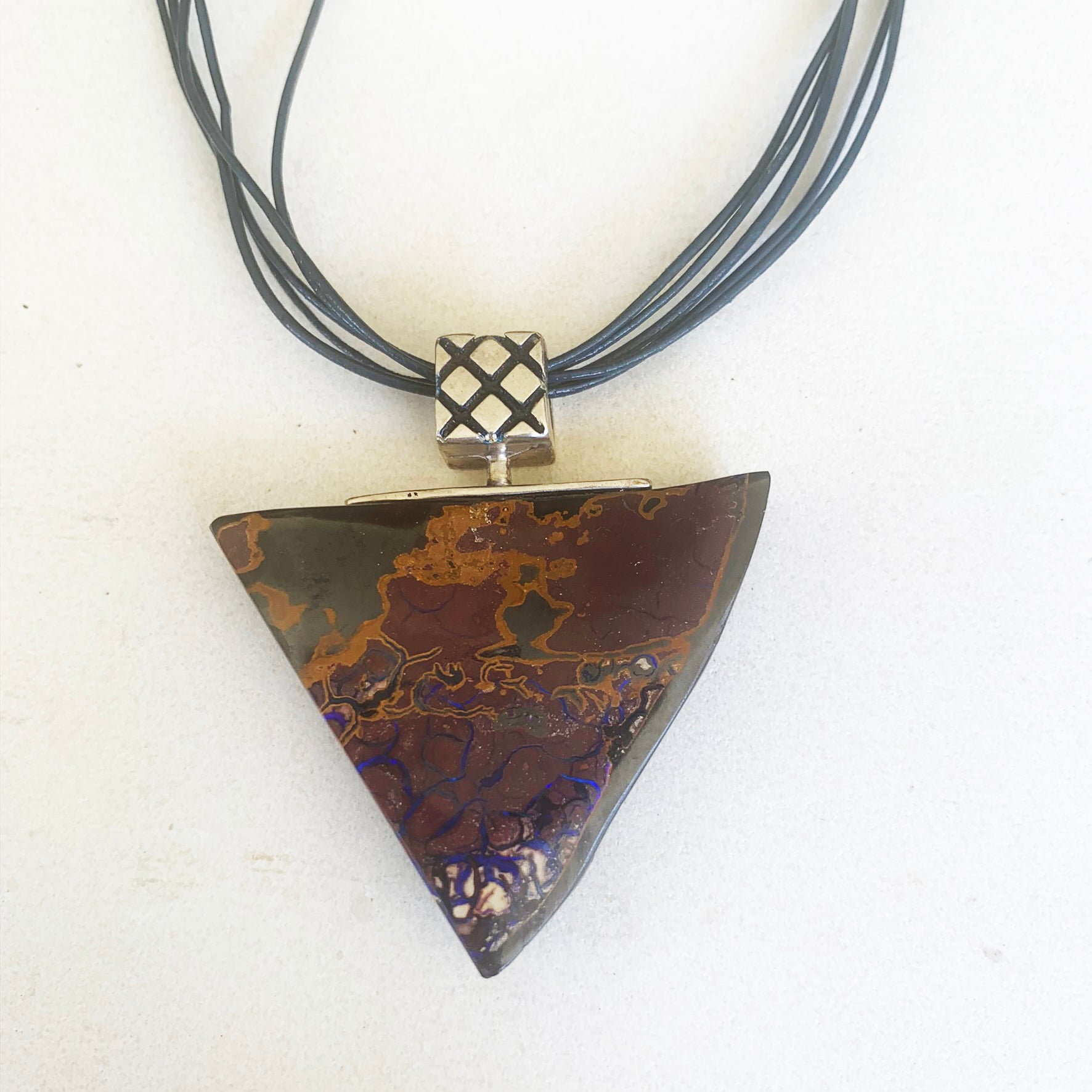 Large triangular boulder opal pendant with artistic pattern