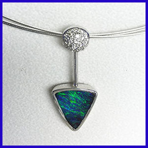 Boulder opal and diamond pendant in white gold