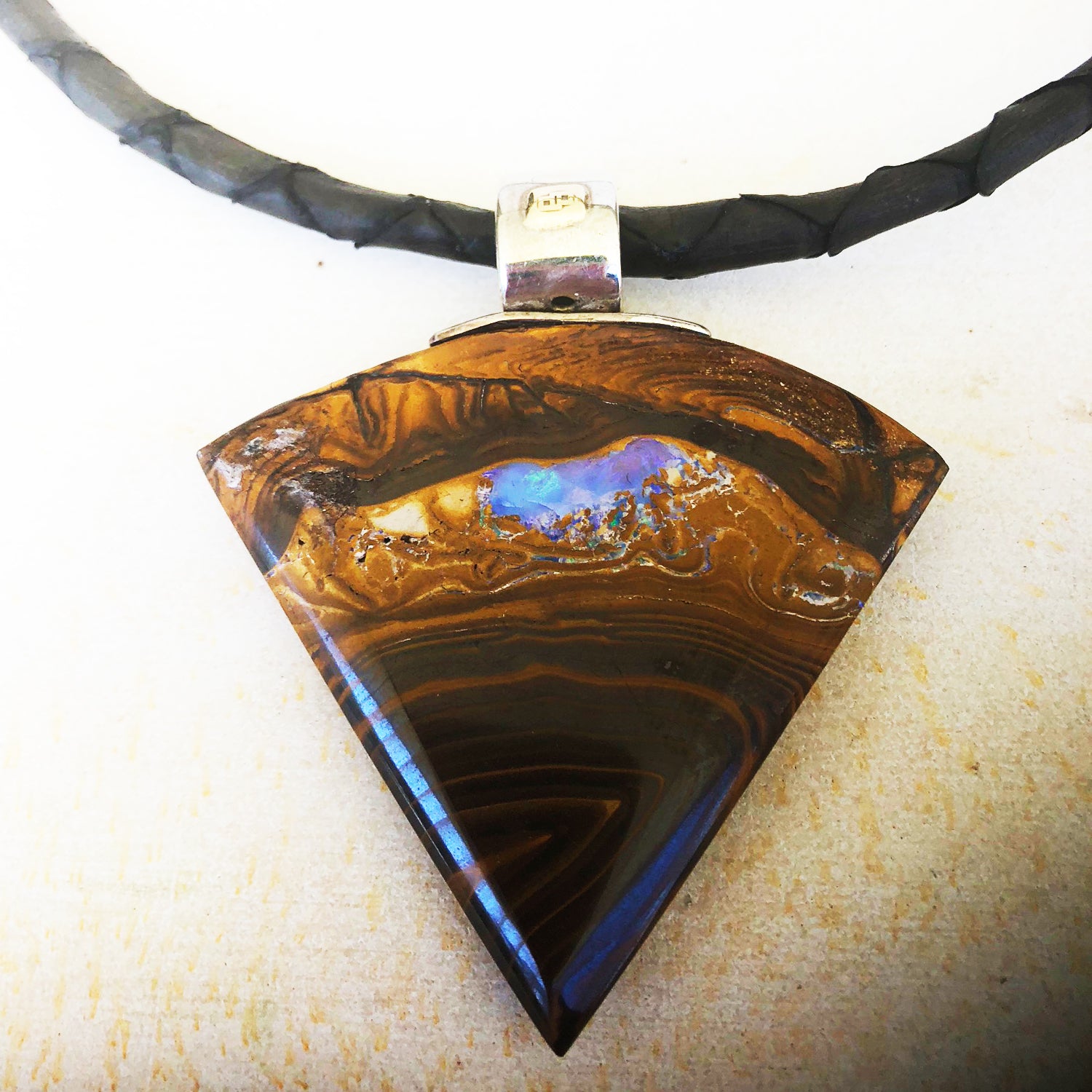 Large triangular boulder opal pendant